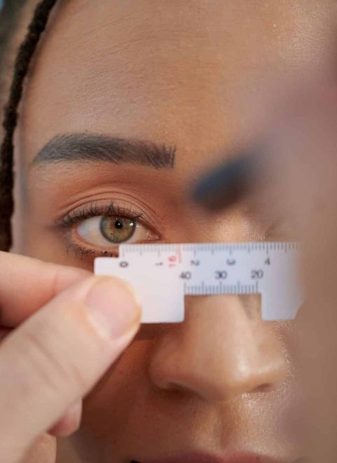 Doctor Measuring Distance Between Eyes